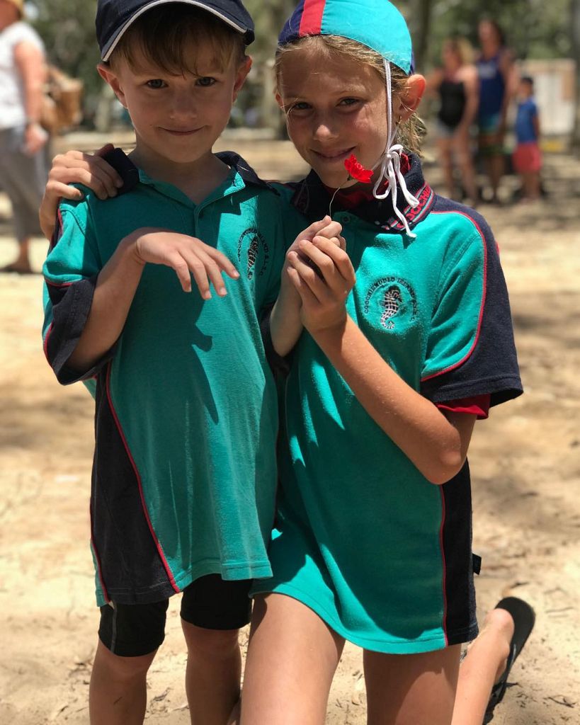 Two children in green Nippers uniforms at Coochiemudlo Island SLSC