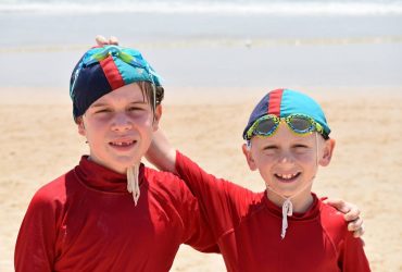 Two young Nippers smiling on Coochiemudlo Island beach